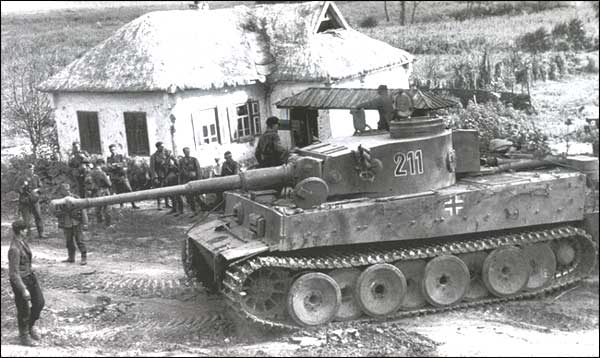 Tiger I, sPzAbt.503, hiding behind an isba.